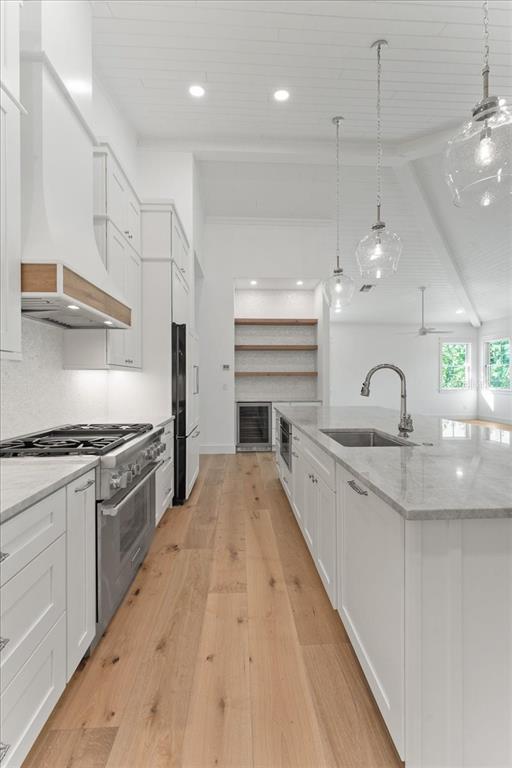 847 Belcher Road Boca Grande, FL 33921 - Photo 23 of 74 a large kitchen with granite countertop a stove and a sink