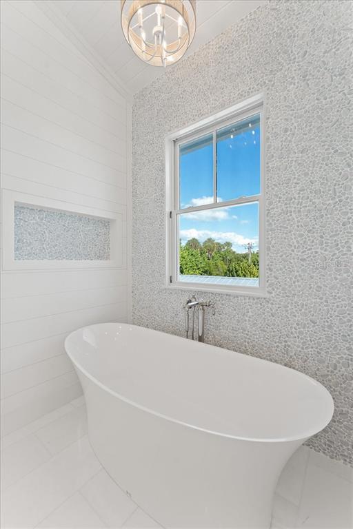 847 Belcher Road Boca Grande, FL 33921 - Photo 34 of 74 a white bath tub sitting next to a window