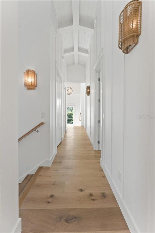 847 Belcher Road Boca Grande, FL 33921 - Photo 34 of 99 a view of a hallway with wooden floor and staircase
