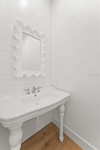 an empty room with a window and a ceiling fan