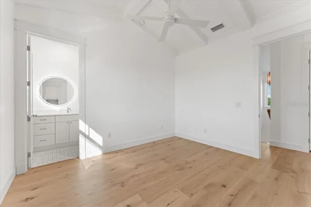 a view of an house with backyard and a garden