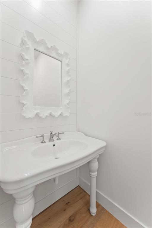 847 Belcher Road Boca Grande, FL 33921 - Photo 51 of 99 a bathroom with a sink a toilet and mirror