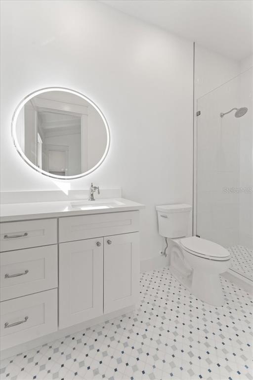 847 Belcher Road Boca Grande, FL 33921 - Photo 54 of 99 a bathroom with a sink a toilet and a mirror