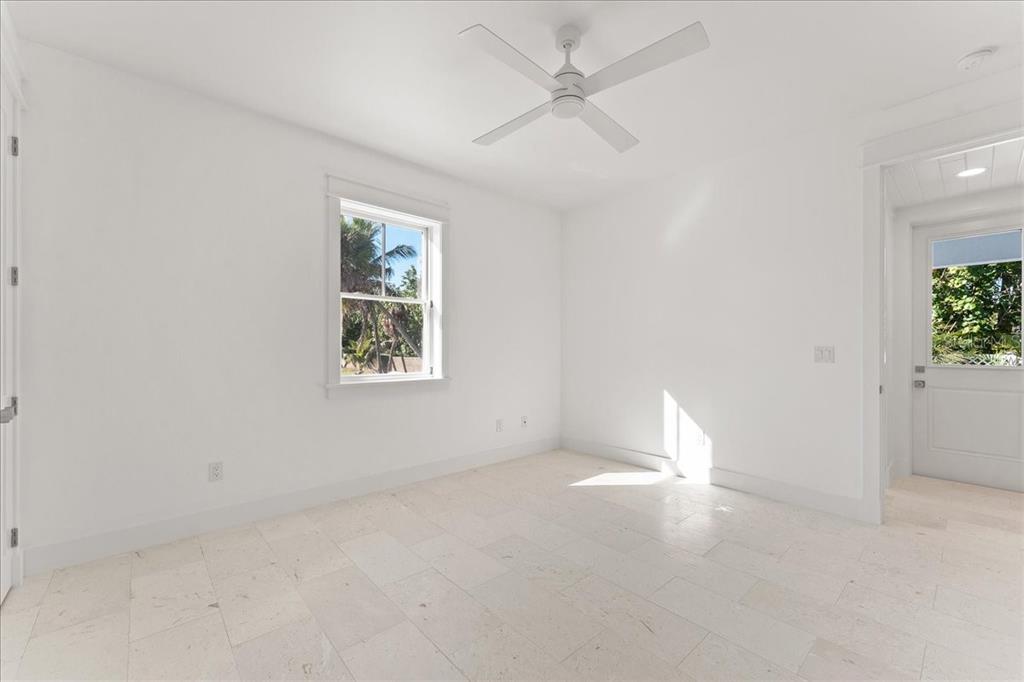 847 Belcher Road Boca Grande, FL 33921 - Photo 55 of 74 an empty room with a window and a ceiling fan