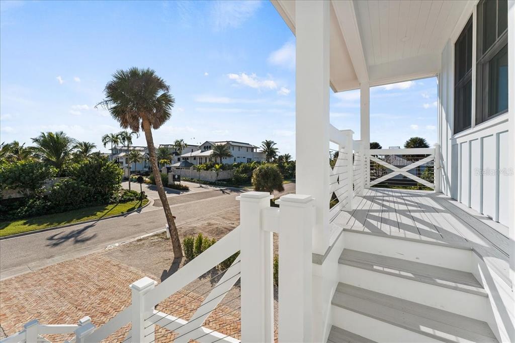 847 Belcher Road Boca Grande, FL 33921 - Photo 65 of 74 a view of a balcony with couch and potted plants