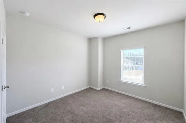 an empty room with windows and window