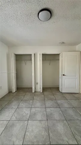 a view of a livingroom with an empty space and chair