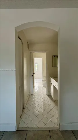 a view of a hallway with a outdoor space