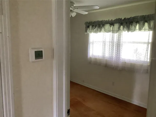 an empty room that has a window in it