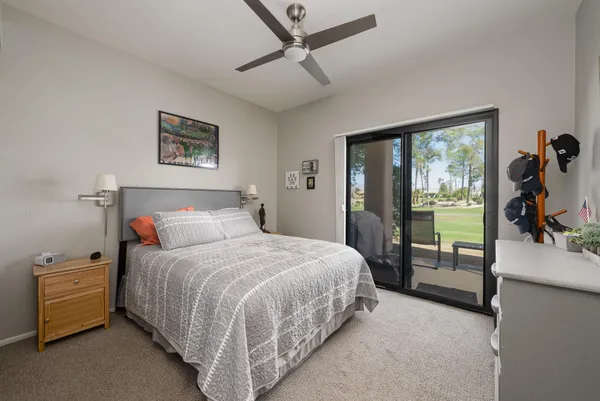 a bedroom with a bed and a tv