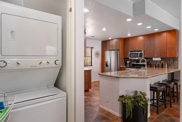 a view of kitchen with cabinets and stainless steel appliances