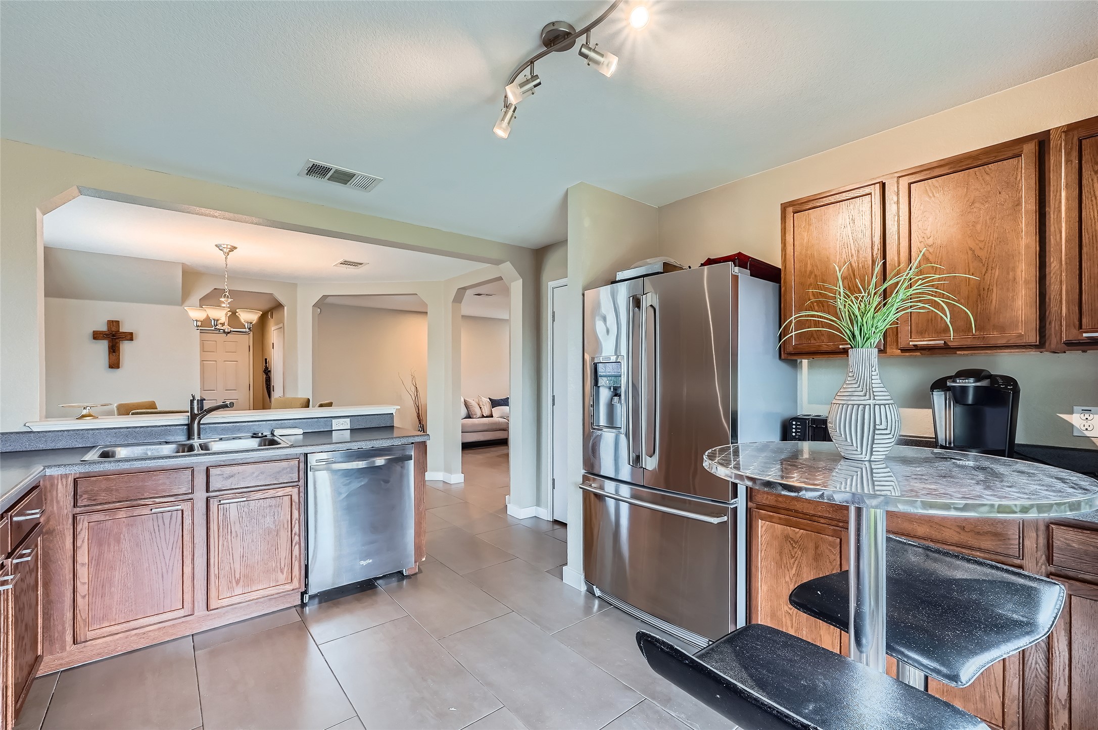 18021 Prairie Verbena Lane Elgin, TX 78621 - Photo 8 of 33 A well-appointed kitchen features stainless steel appliances and a convenient breakfast bar.