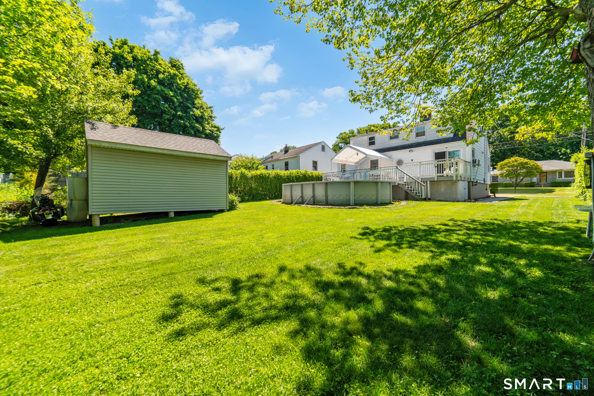 146 Highland Drive Waterbury, CT 06708 - Photo 25 of 31 a view of a big yard with plants and large trees