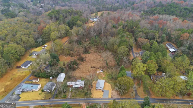 an aerial view of house with yard swimming pool and outdoor seating