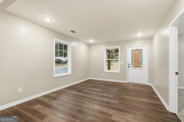 a view of an empty room with a window