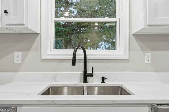 a close view of a sink and a window