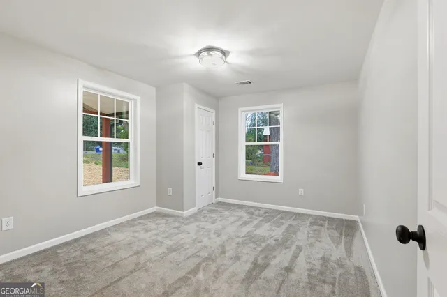 an empty room with windows