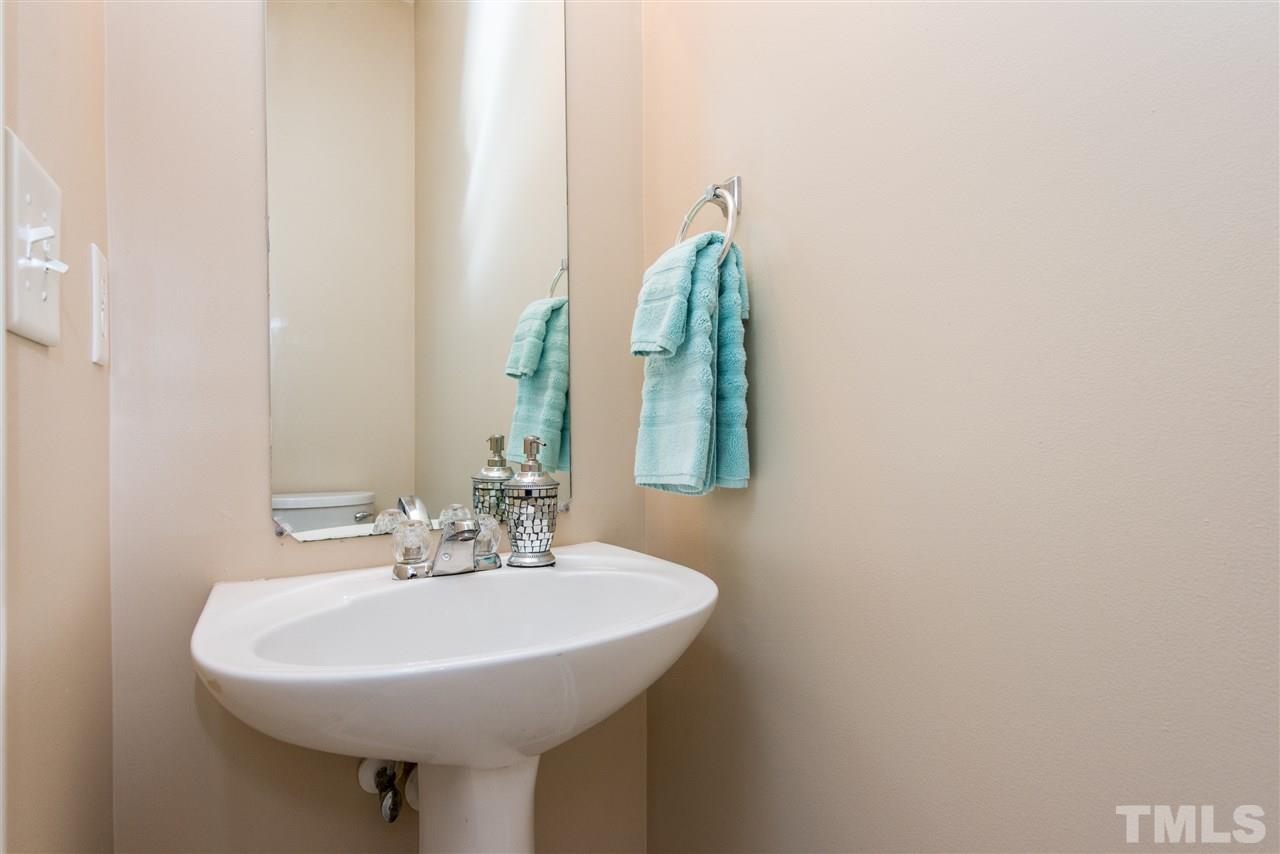 106 Eldon Lane Apex, NC 27502 - Photo 12 of 22 a bathroom with a sink and a mirror