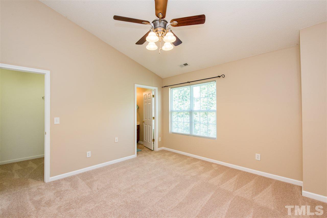 106 Eldon Lane Apex, NC 27502 - Photo 13 of 22 a view of an empty room with a window