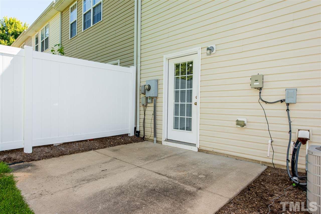 106 Eldon Lane Apex, NC 27502 - Photo 19 of 22 a view of a house with a backyard