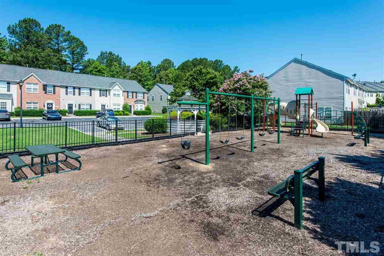 106 Eldon Lane Apex, NC 27502 - Photo 22 of 22 a view of house with backyard and a garden