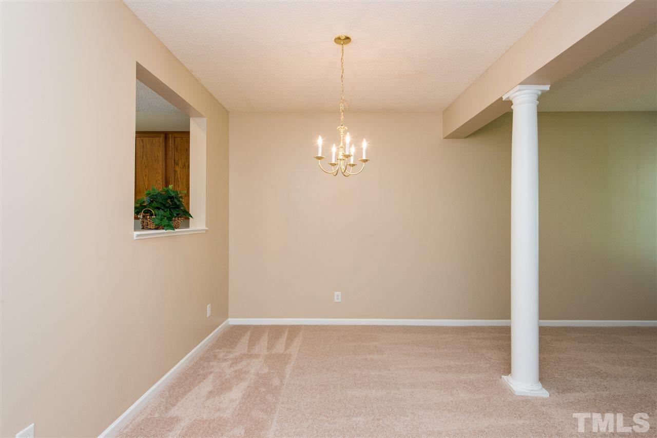 106 Eldon Lane Apex, NC 27502 - Photo 8 of 22 a view of an empty room with a window