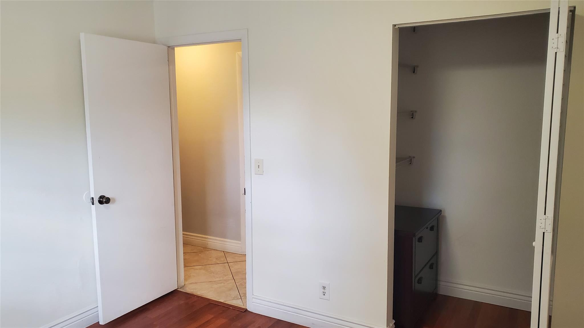 10734 Shady Pond Lane Boca Raton, FL 33428 - Photo 12 of 23 a view of a hallway with wooden floor