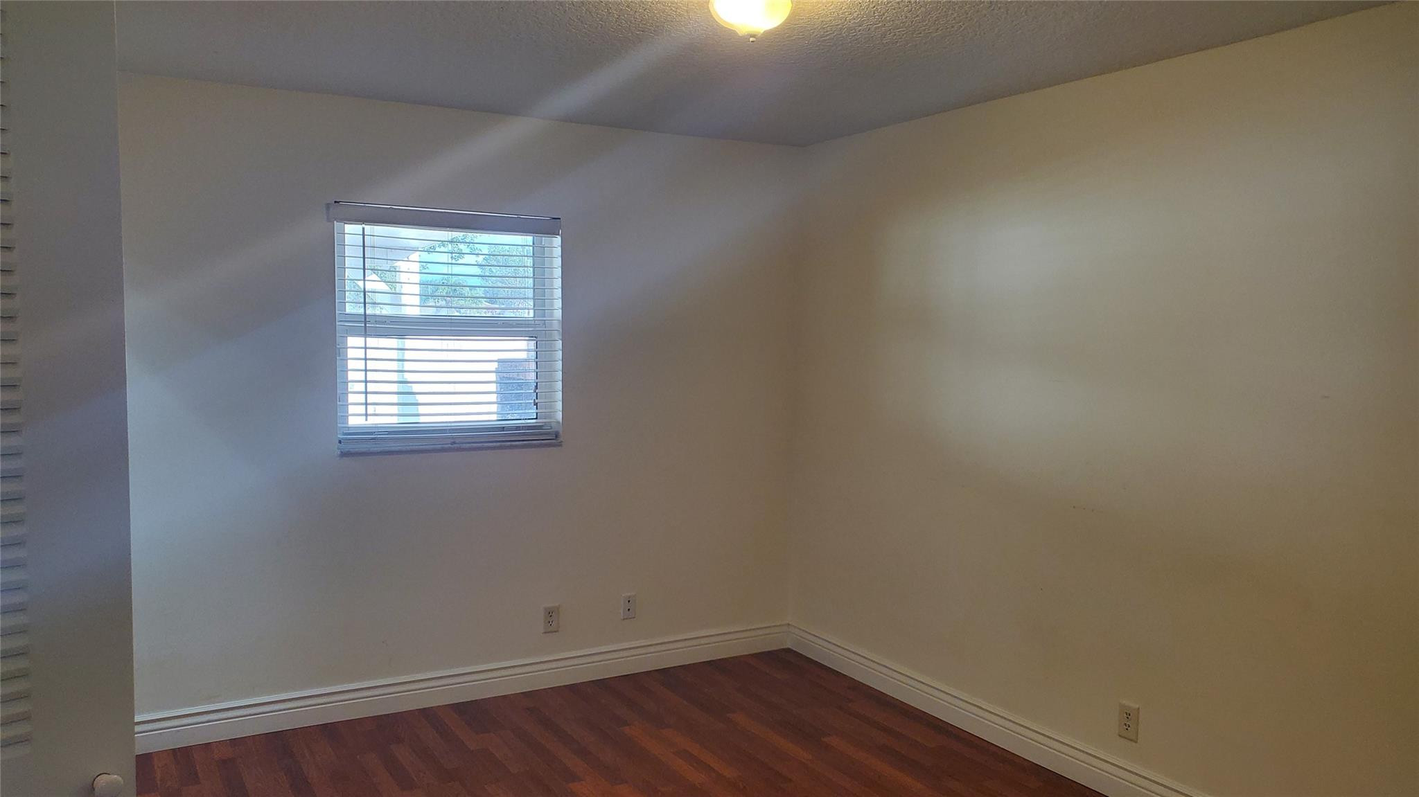10734 Shady Pond Lane Boca Raton, FL 33428 - Photo 13 of 23 an empty room with a window