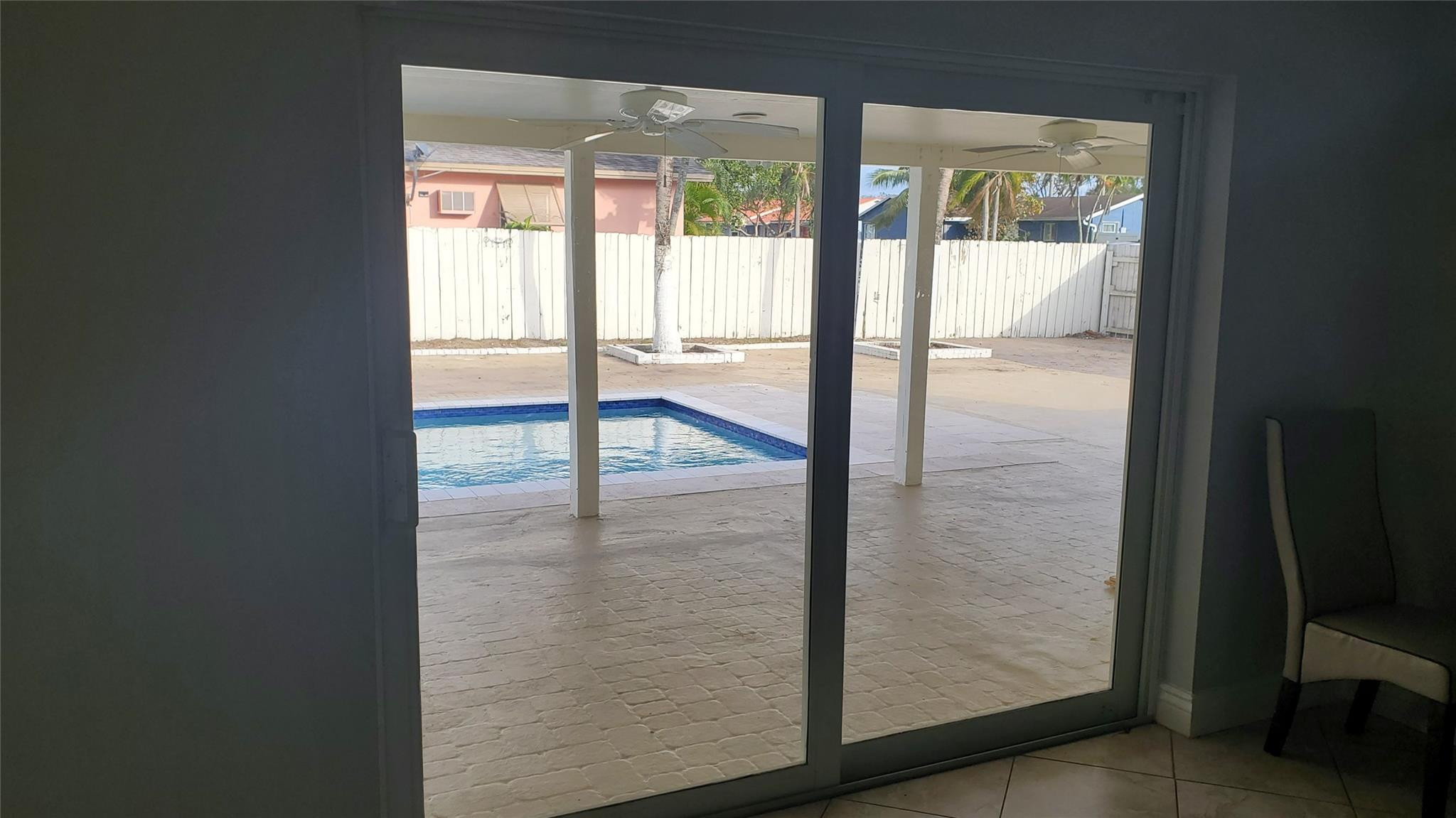 10734 Shady Pond Lane Boca Raton, FL 33428 - Photo 16 of 23 an empty room with sliding glass door