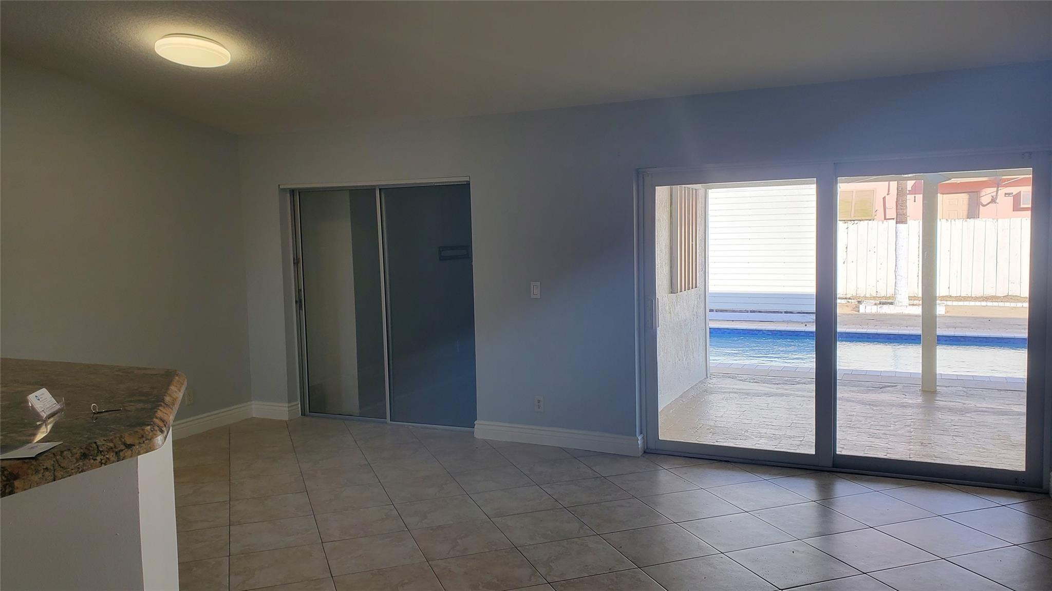 10734 Shady Pond Lane Boca Raton, FL 33428 - Photo 3 of 23 a view of an empty room and window