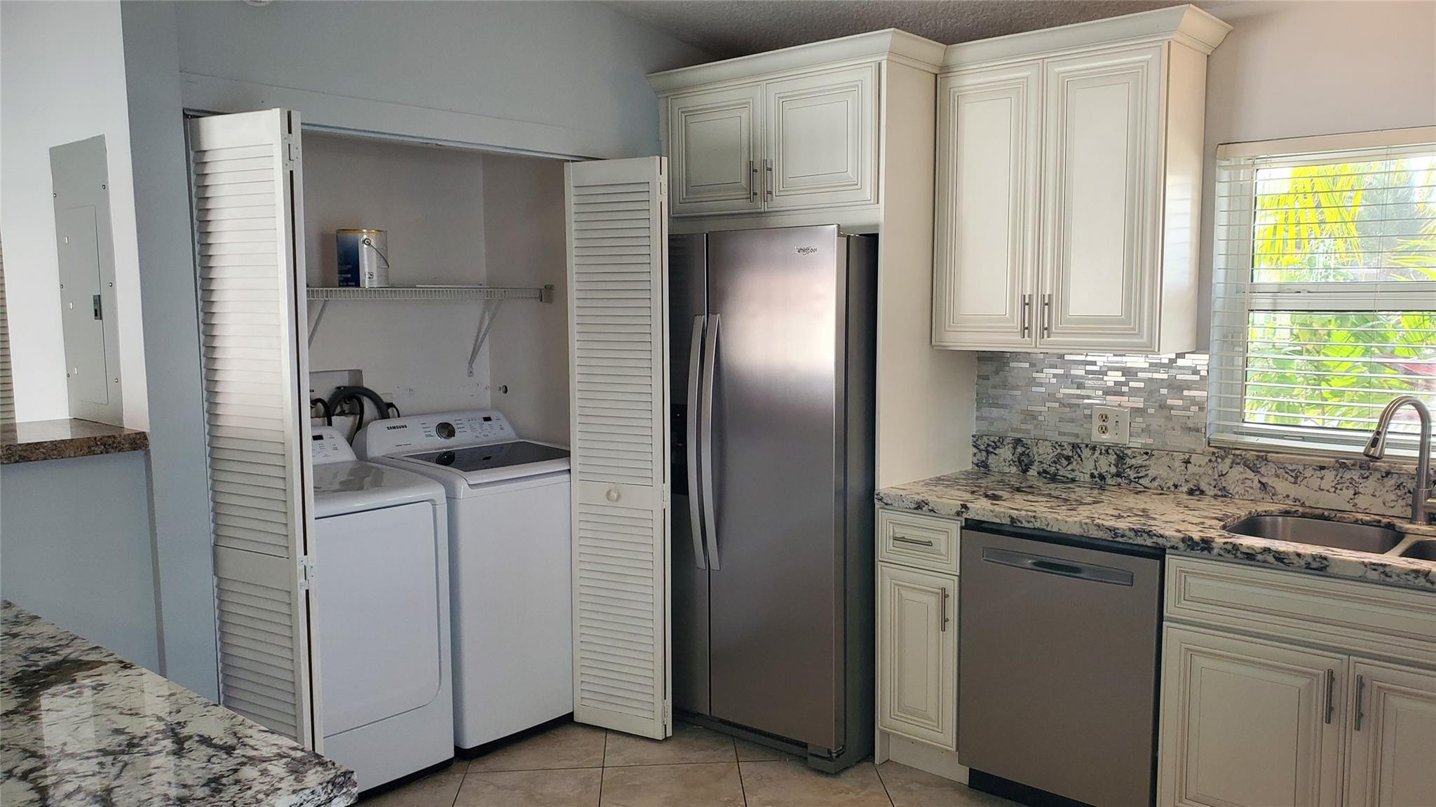 10734 Shady Pond Lane Boca Raton, FL 33428 - Photo 5 of 23 a kitchen with a sink and a refrigerator