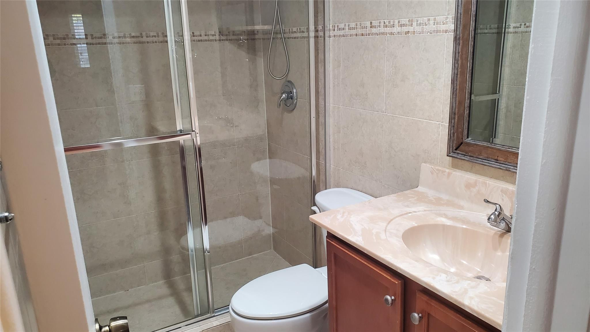 10734 Shady Pond Lane Boca Raton, FL 33428 - Photo 9 of 23 a bathroom with a granite countertop sink toilet and shower