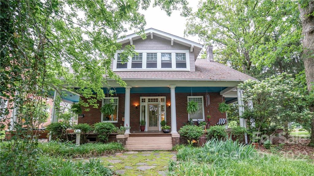 100 Morehead Street Morganton, NC 28655 - Photo 1 of 37 a front view of a house with garden