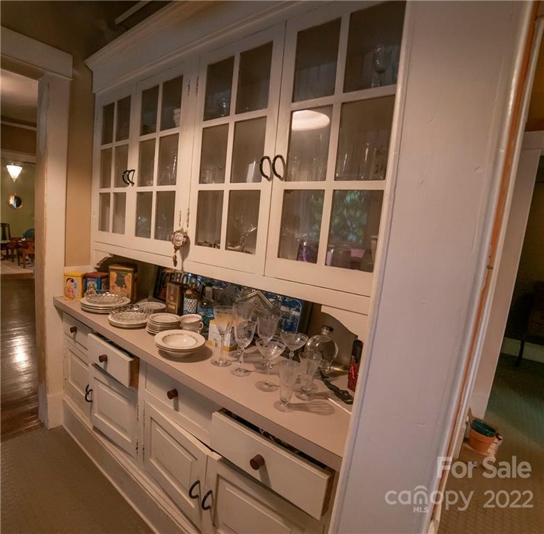 100 Morehead Street Morganton, NC 28655 - Photo 15 of 37 a bathroom with a sink and a large mirror