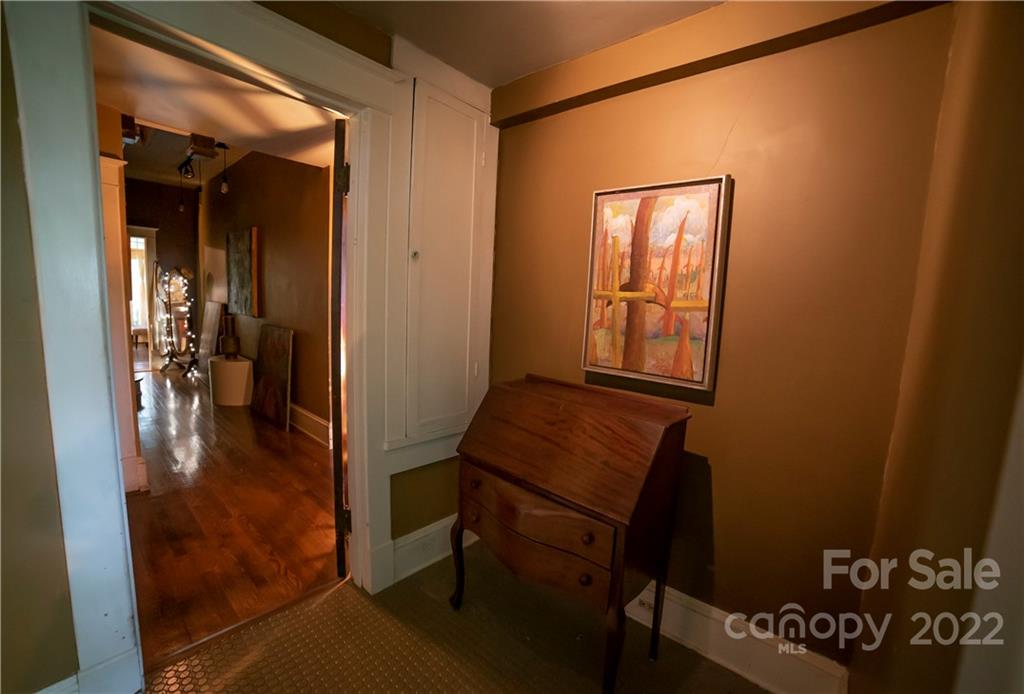 100 Morehead Street Morganton, NC 28655 - Photo 19 of 37 a view of a hallway and a livingroom with furniture