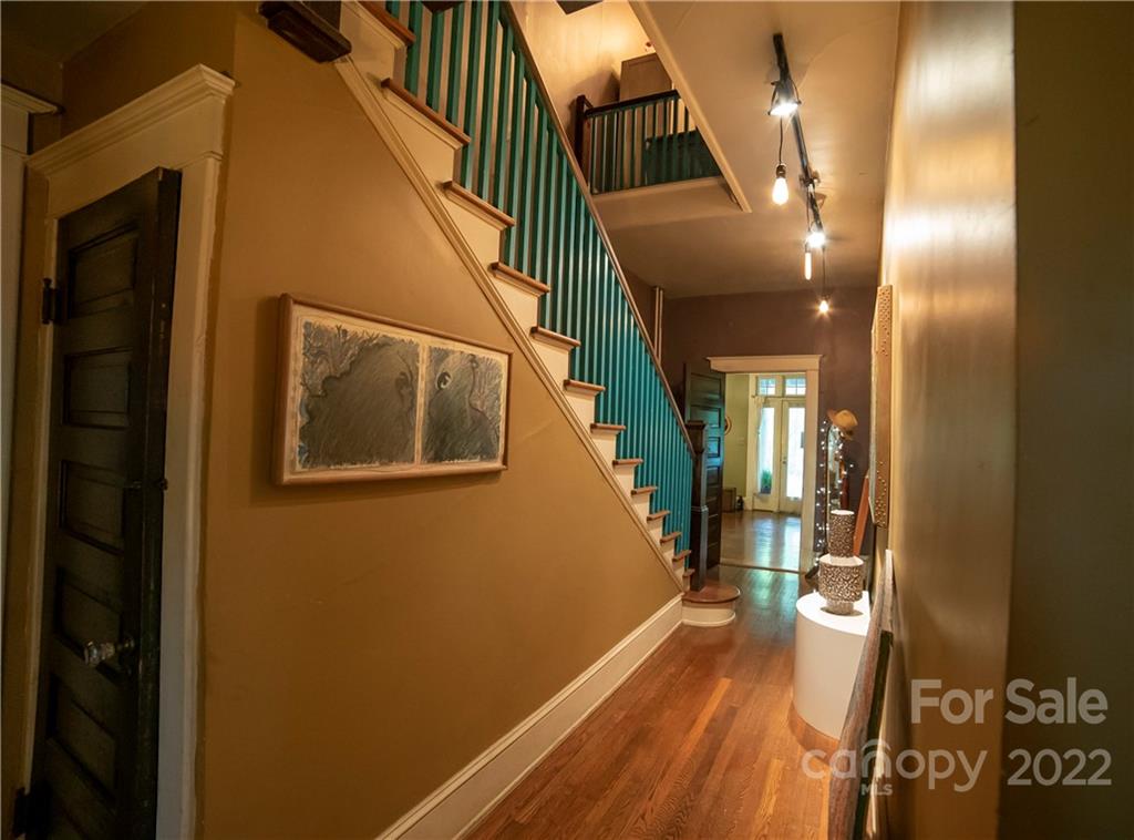 100 Morehead Street Morganton, NC 28655 - Photo 24 of 37 a view of hallway with livingroom and stairs