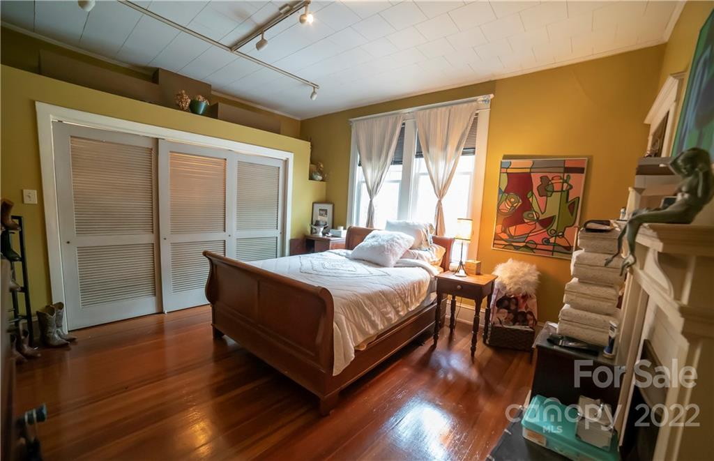 100 Morehead Street Morganton, NC 28655 - Photo 26 of 37 a bed sitting in a room next to a window