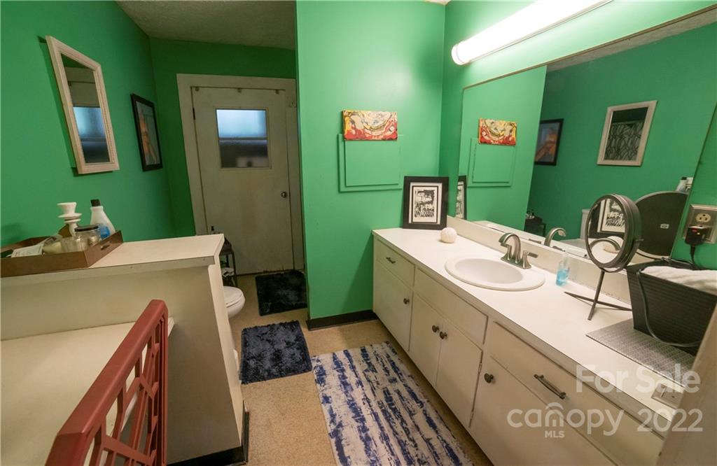100 Morehead Street Morganton, NC 28655 - Photo 28 of 37 a bathroom with a sink and mirror