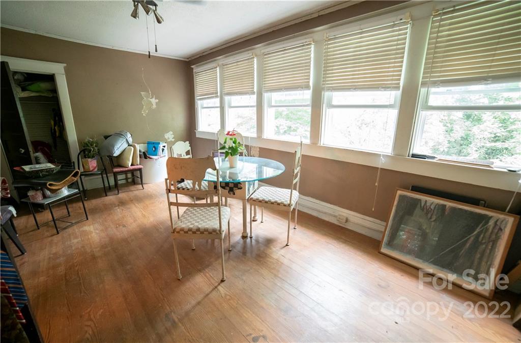 100 Morehead Street Morganton, NC 28655 - Photo 31 of 37 a living room with furniture a flat screen tv and a large window