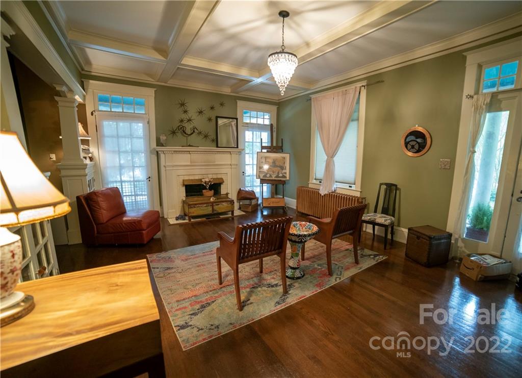 100 Morehead Street Morganton, NC 28655 - Photo 7 of 37 a living room with fireplace furniture and a large window