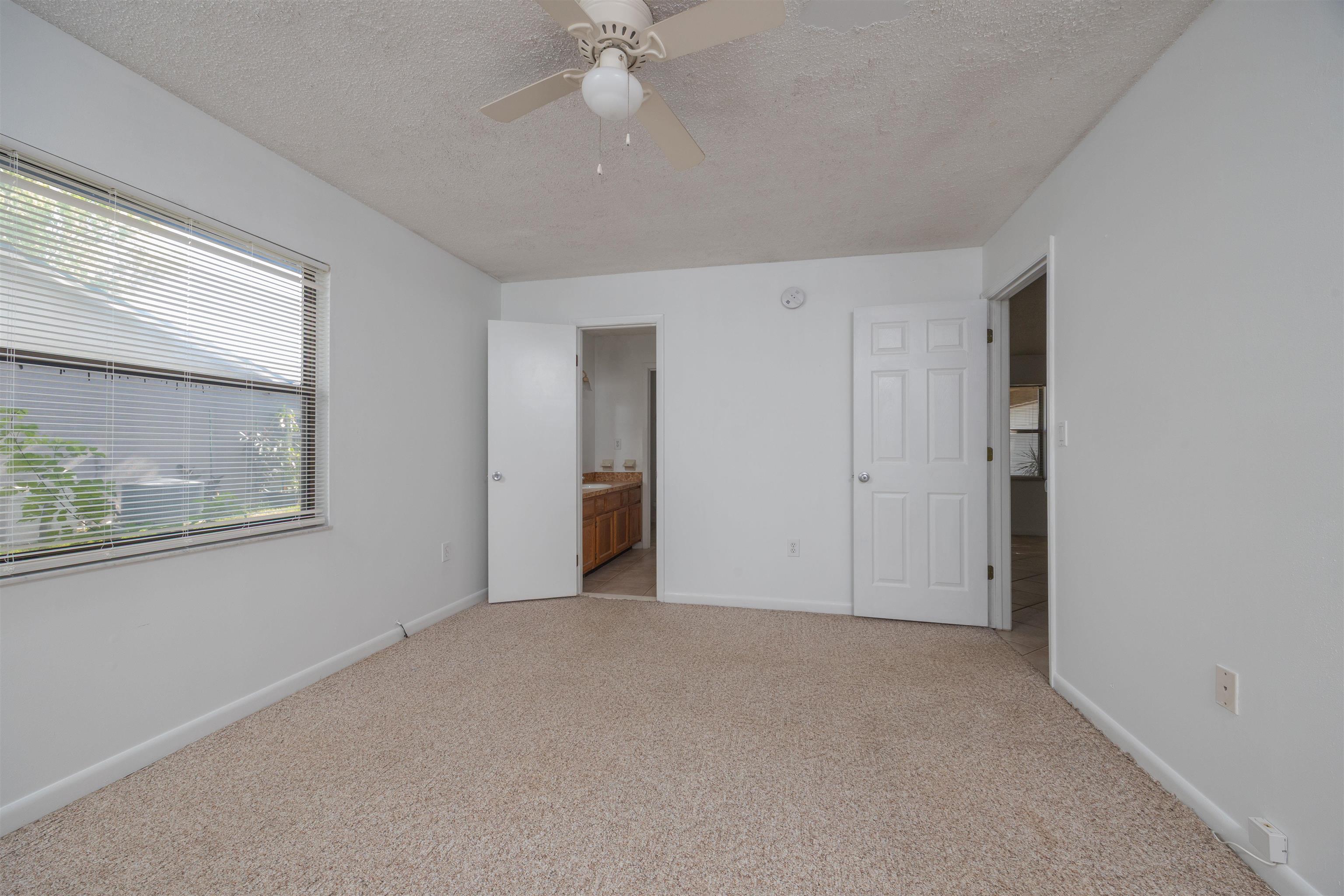 114 Lobelia Road St. Augustine, FL 32086 - Photo 18 of 38 an empty room with fan and windows