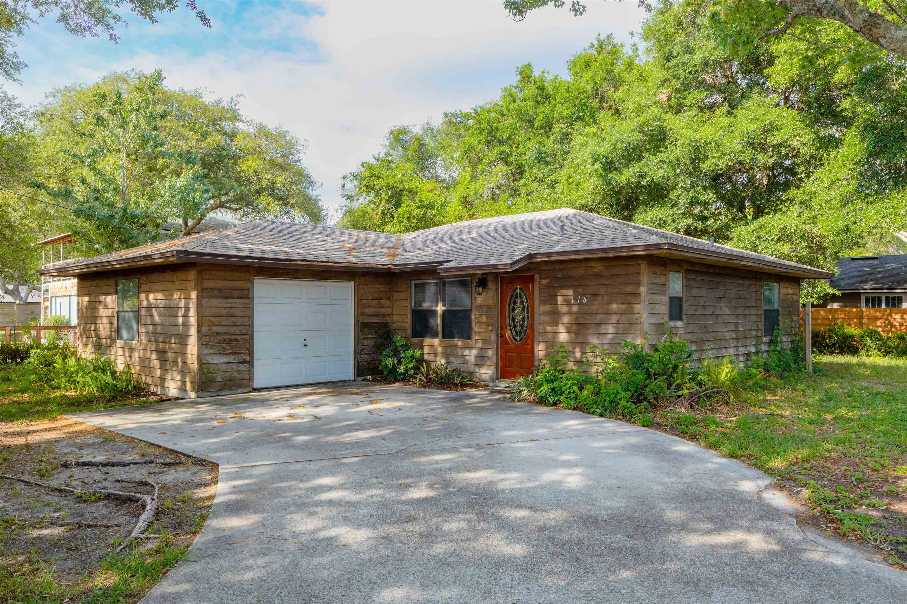 114 Lobelia Road St. Augustine, FL 32086 - Photo 2 of 38 a front view of a house with yard and green space