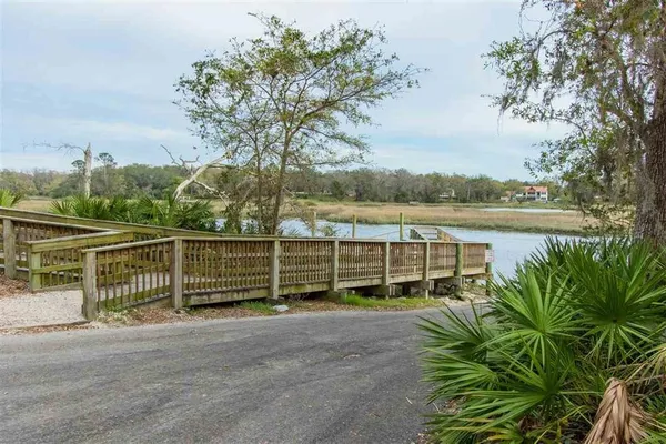 a view of a street with a lake view