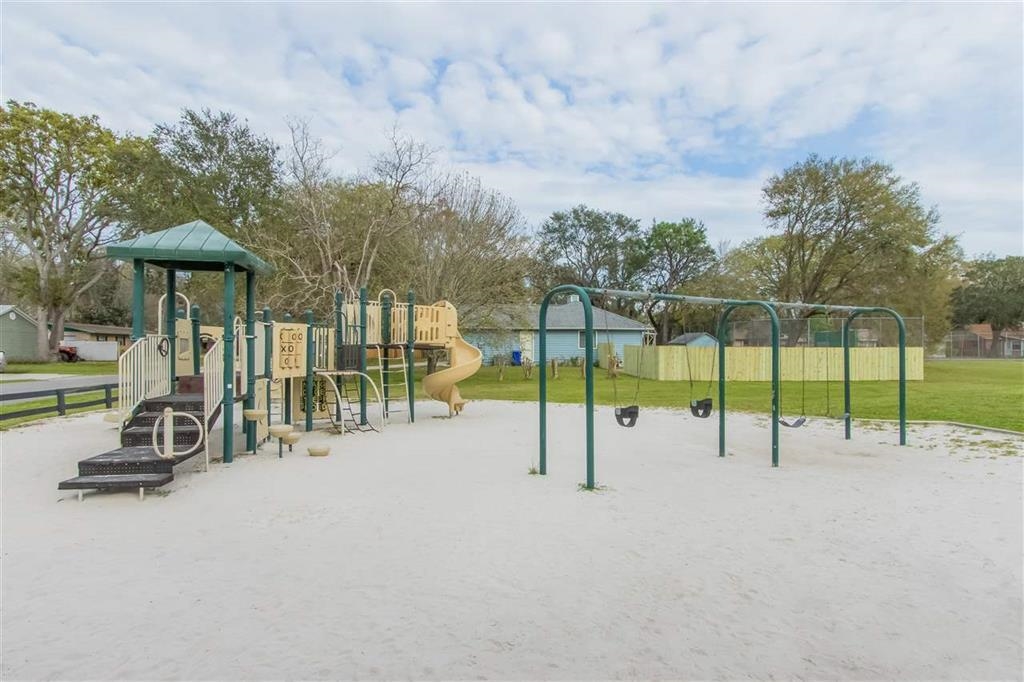 114 Lobelia Road St. Augustine, FL 32086 - Photo 33 of 38 a view of a park with swings