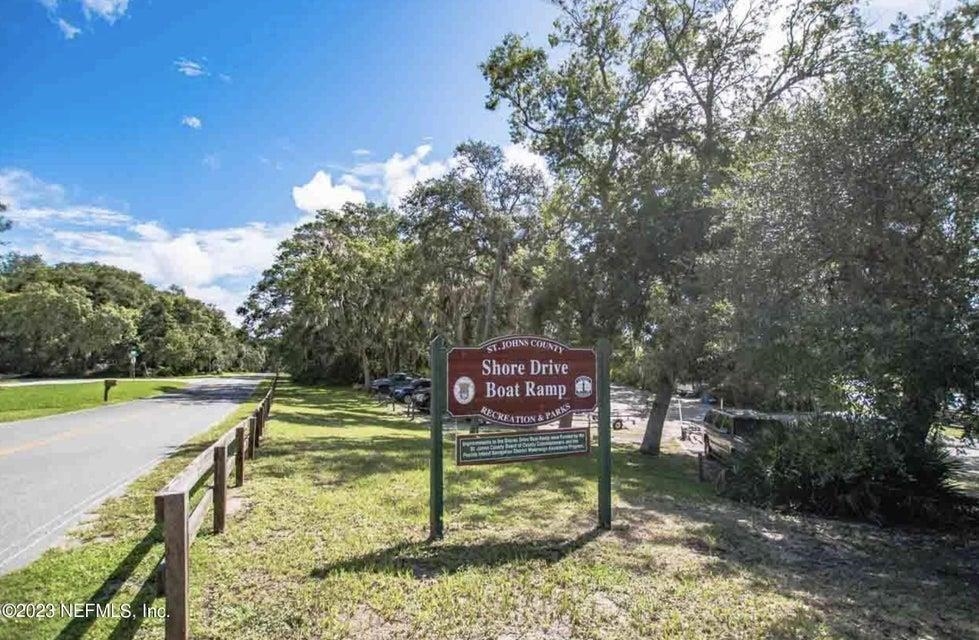 114 Lobelia Road St. Augustine, FL 32086 - Photo 36 of 38 a view of a park that has a sign board large trees
