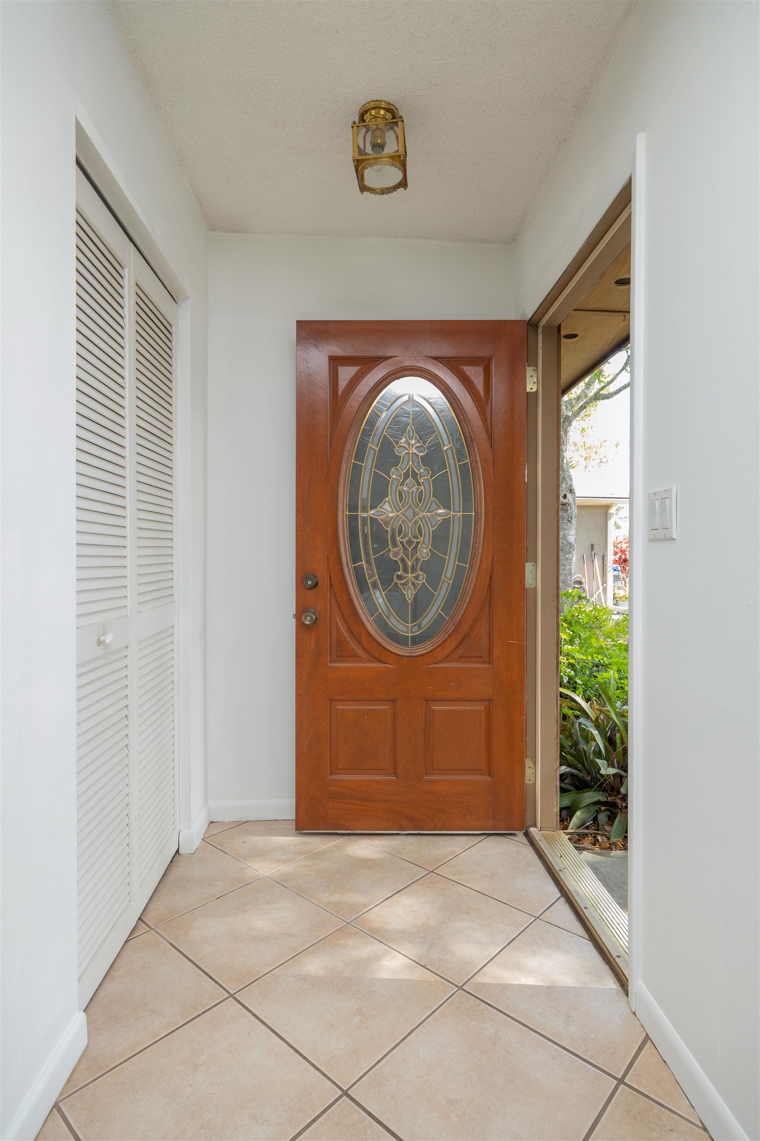 114 Lobelia Road St. Augustine, FL 32086 - Photo 4 of 38 a view of a livingroom with wooden floor and a large window