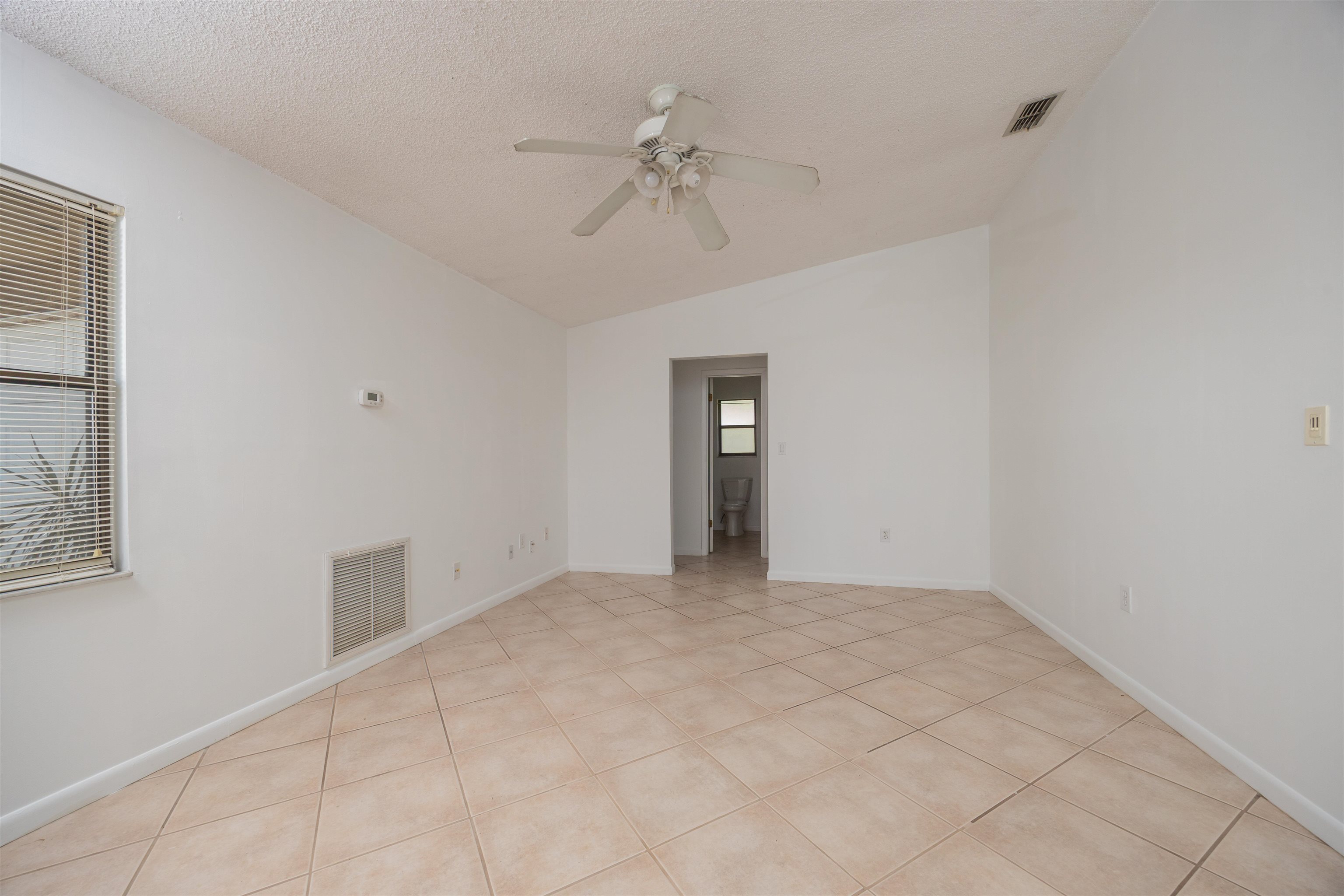 114 Lobelia Road St. Augustine, FL 32086 - Photo 5 of 38 a view of an empty room with a window