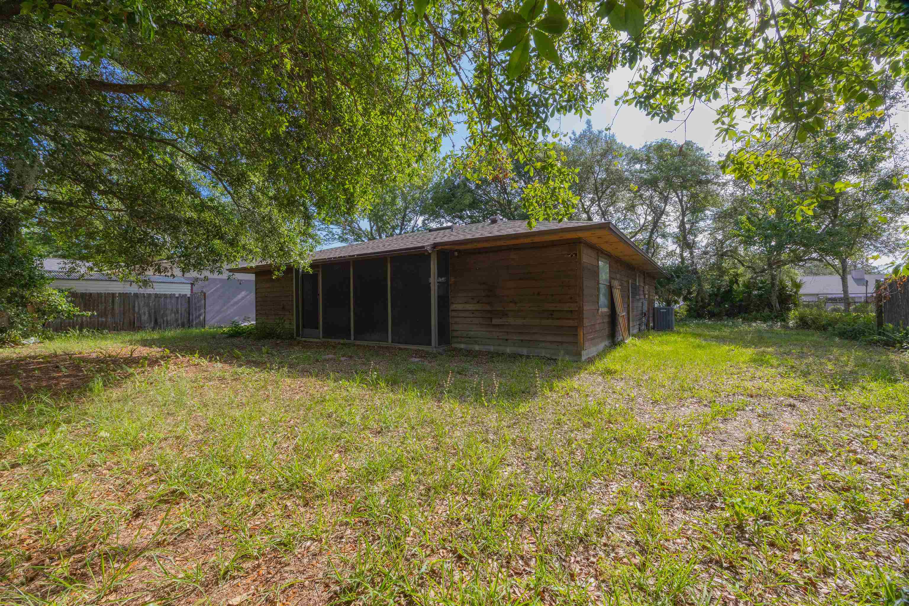 114 Lobelia Road St. Augustine, FL 32086 - Photo 9 of 38 a backyard of a house with lots of green space