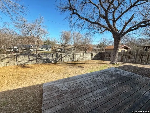 a swimming pool with outdoor seating and yard