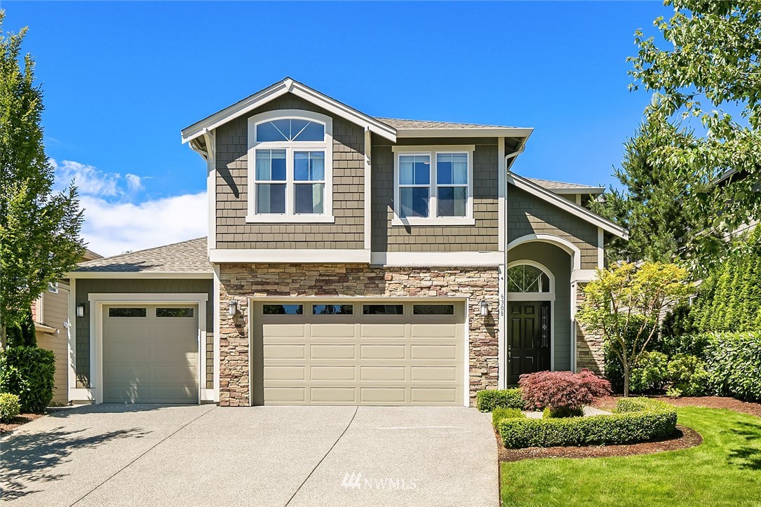 6308 Southeast 2nd Street Renton, WA 98059 - Photo 2 of 29 a front view of a house with a yard and garage